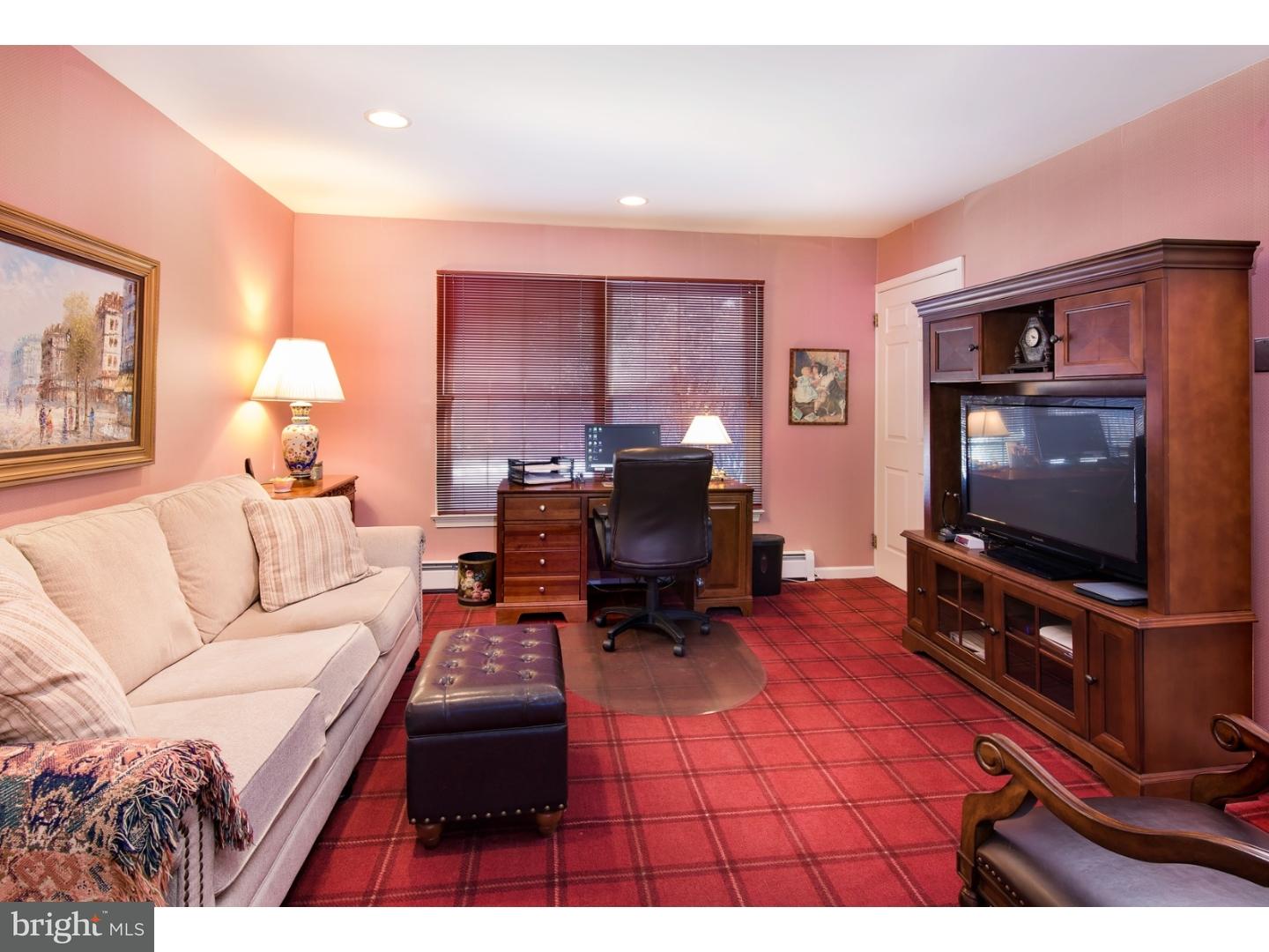 511 Old Gulph Road Penn Valley, PA 19072 - Photo 11 of 24 a living room with furniture and a flat screen tv