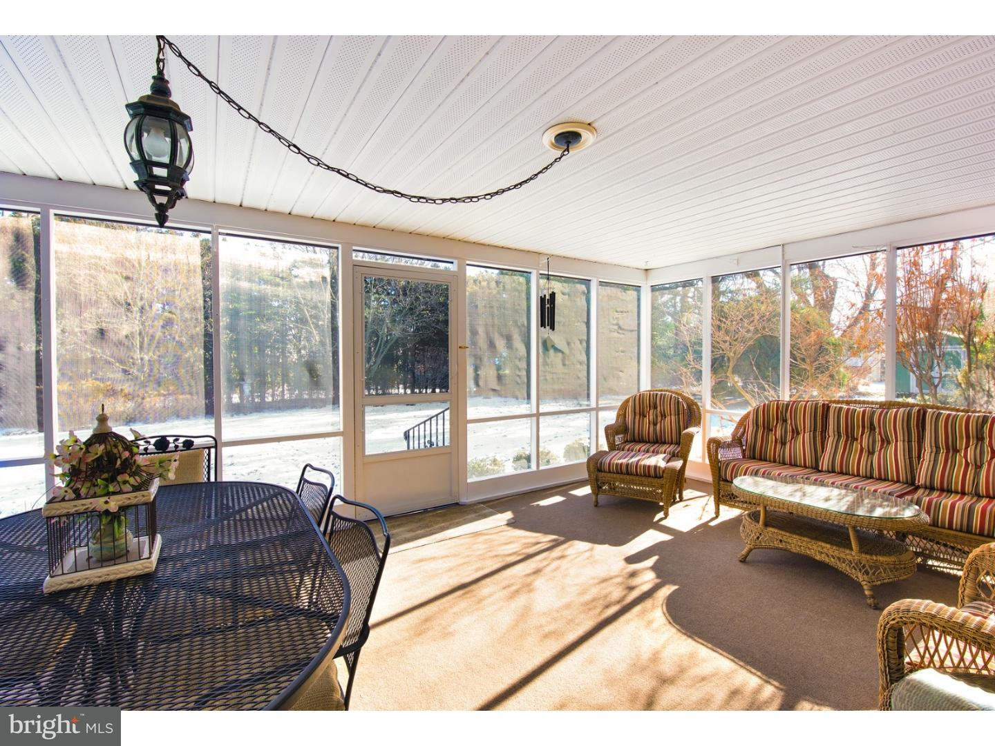 511 Old Gulph Road Penn Valley, PA 19072 - Photo 12 of 24 a living room with furniture and a large window