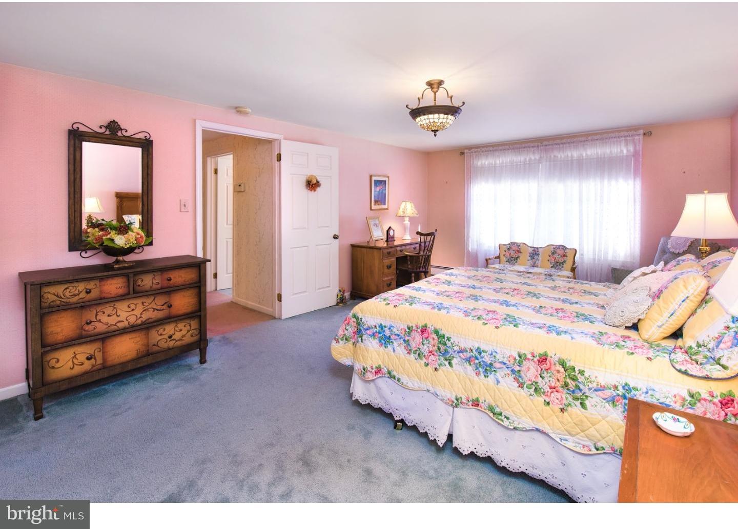 511 Old Gulph Road Penn Valley, PA 19072 - Photo 16 of 24 a bedroom with a bed and a dresser in it