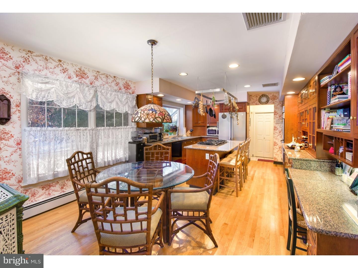 511 Old Gulph Road Penn Valley, PA 19072 - Photo 8 of 24 a dining room with furniture and a floor to ceiling window