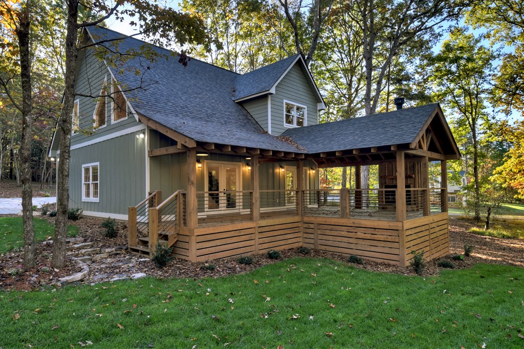 646 High Country Crossing Morganton, GA 30560 - Photo 13 of 44 a view of a house with a yard and wooden fence