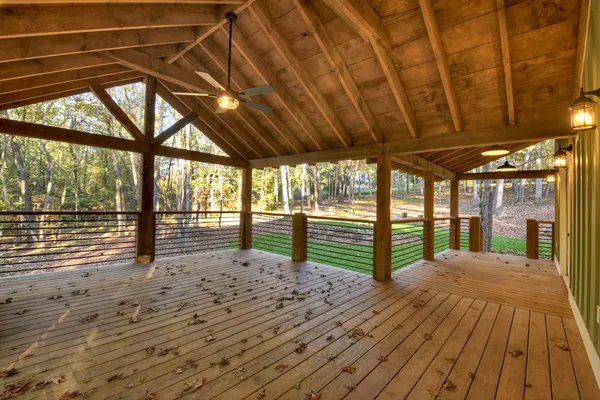 a view of porch with wooden floor