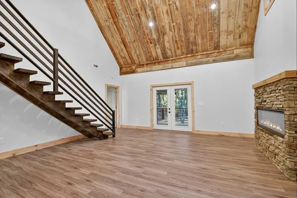 a view of an entryway with wooden floor