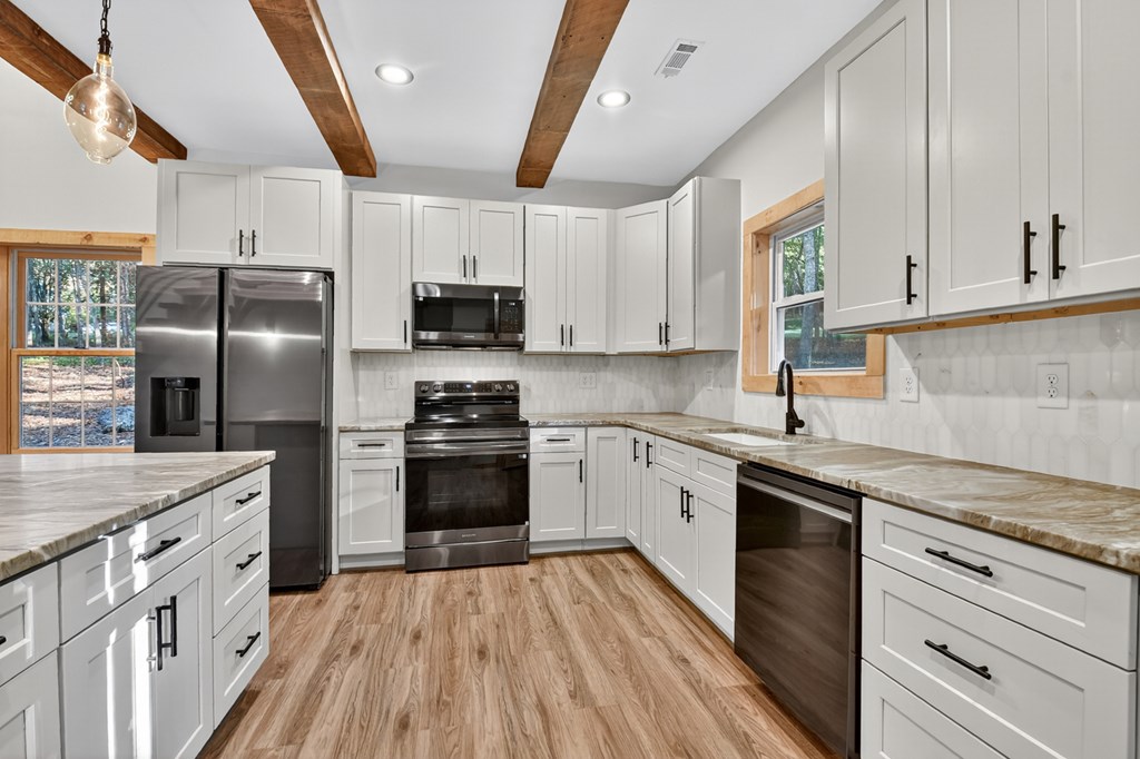 646 High Country Crossing Morganton, GA 30560 - Photo 25 of 44 a kitchen with stainless steel appliances a refrigerator sink and microwave