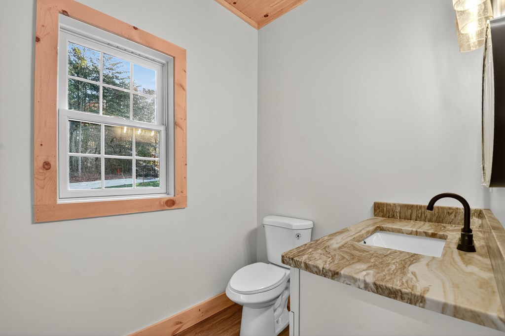 646 High Country Crossing Morganton, GA 30560 - Photo 27 of 44 a bathroom with a toilet sink and mirror