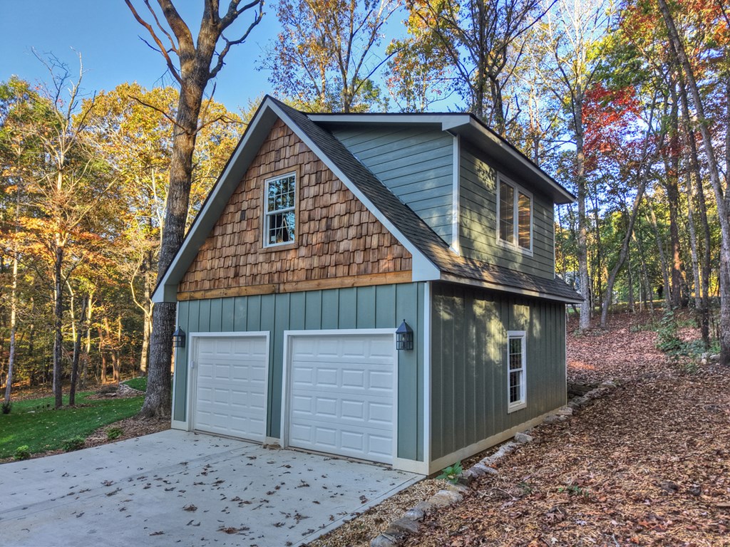 646 High Country Crossing Morganton, GA 30560 - Photo 39 of 44 a front view of a house with garden