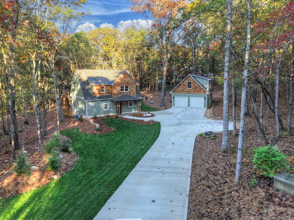 646 High Country Crossing Morganton, GA 30560 - Photo 43 of 44 a front view of a house with a yard and large tree