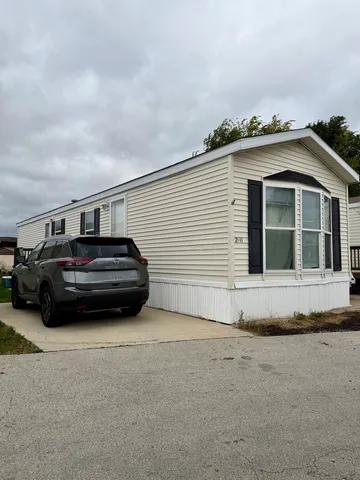 a view of a car in front of a house