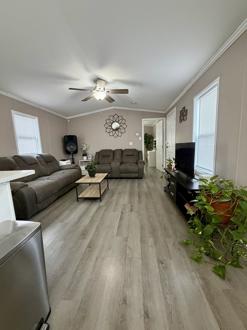 8800 South Harlem Avenue, Unit 2111 Bridgeview, IL 60455 - Photo 5 of 11 a living room with furniture and a flat screen tv