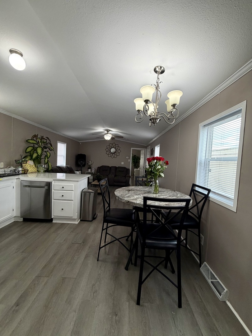 8800 South Harlem Avenue, Unit 2111 Bridgeview, IL 60455 - Photo 6 of 11 a view of a dining room with furniture and chandelier