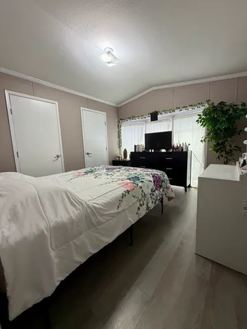 a bedroom with a bed and a couch