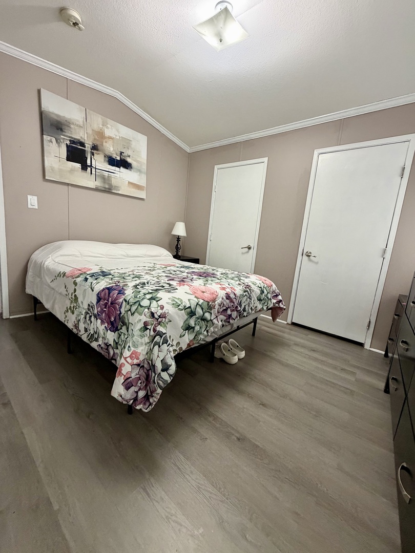 8800 South Harlem Avenue, Unit 2111 Bridgeview, IL 60455 - Photo 8 of 11 a bedroom with a bed painting on the wall and a window