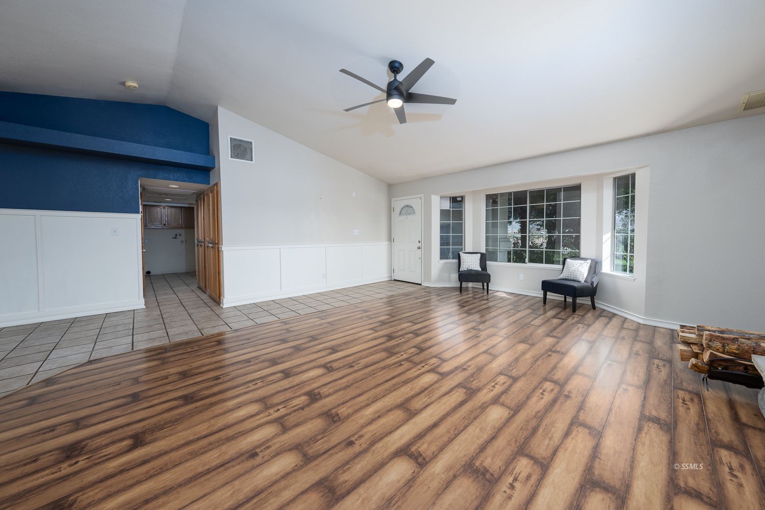 424 Olive Avenue Ridgecrest, CA 93555 - Photo 2 of 46 a view of a livingroom with wooden floor and a ceiling fan