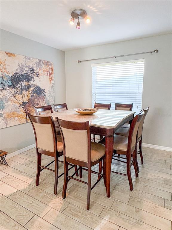 12715 Saulston Place Hudson, FL 34669 - Photo 11 of 44 a view of a dining room with furniture