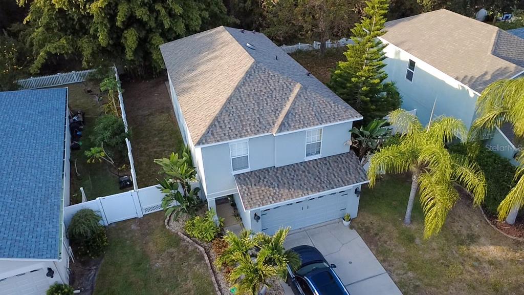 12715 Saulston Place Hudson, FL 34669 - Photo 2 of 44 an aerial view of a house with garden space and street view