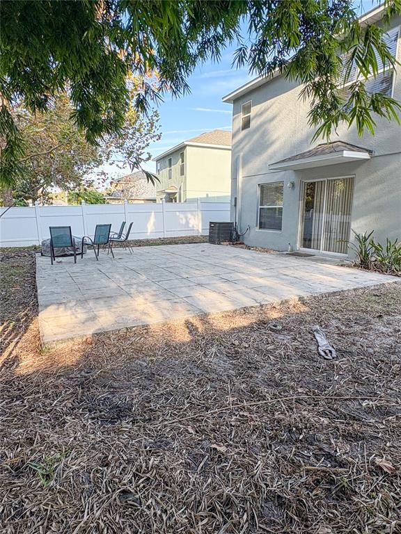 12715 Saulston Place Hudson, FL 34669 - Photo 21 of 44 a view of a house with backyard
