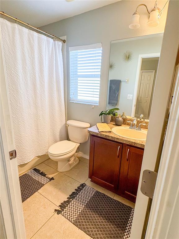 12715 Saulston Place Hudson, FL 34669 - Photo 24 of 44 a bathroom with a sink toilet and shower