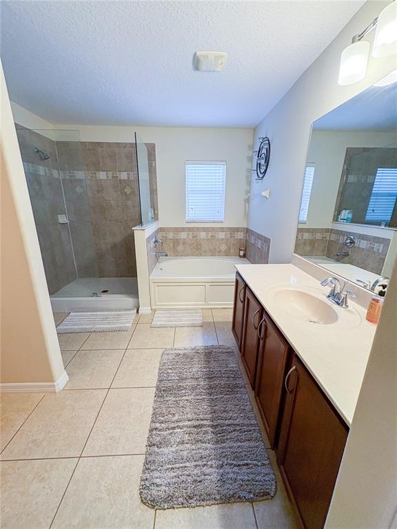 12715 Saulston Place Hudson, FL 34669 - Photo 37 of 44 a bathroom with a sink a toilet and shower