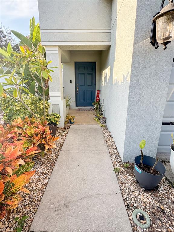 12715 Saulston Place Hudson, FL 34669 - Photo 5 of 44 a backyard of a house with outdoor seating