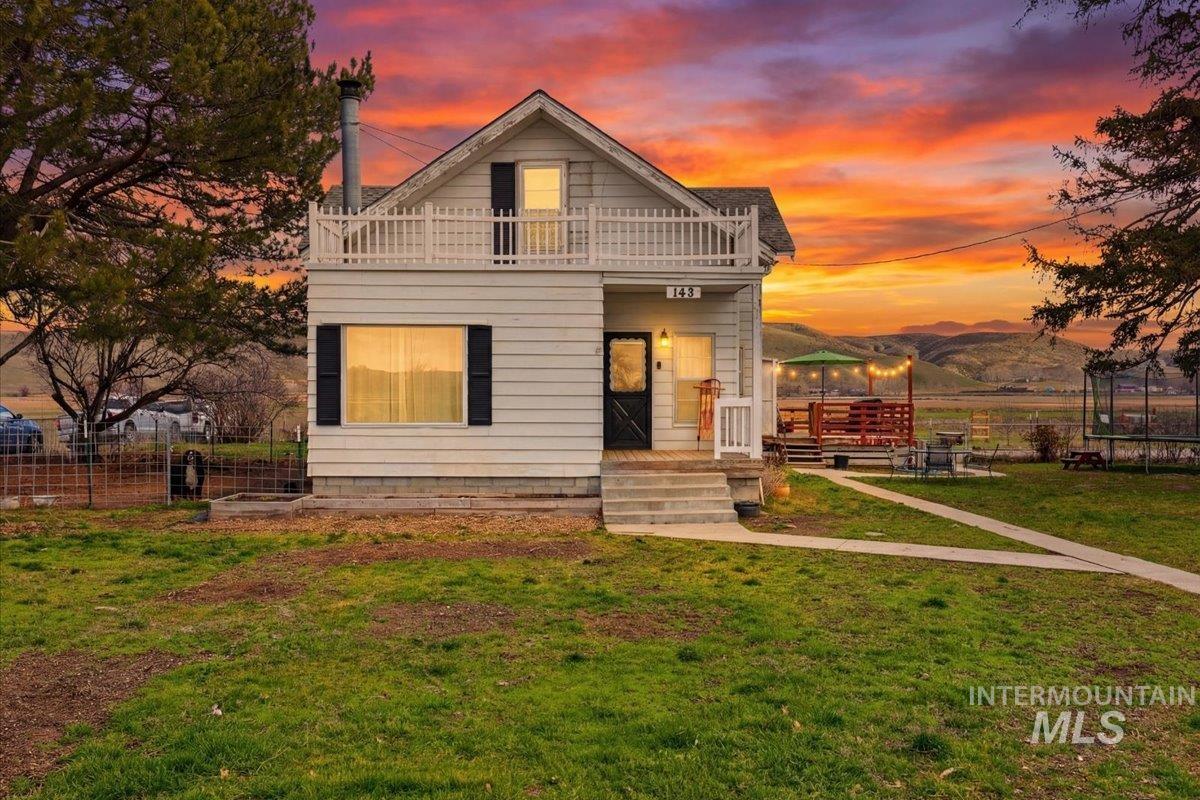 148 Glascock Road Weiser, ID 83672 - Photo 1 of 32 View of front of property featuring a mountain view and a balcony