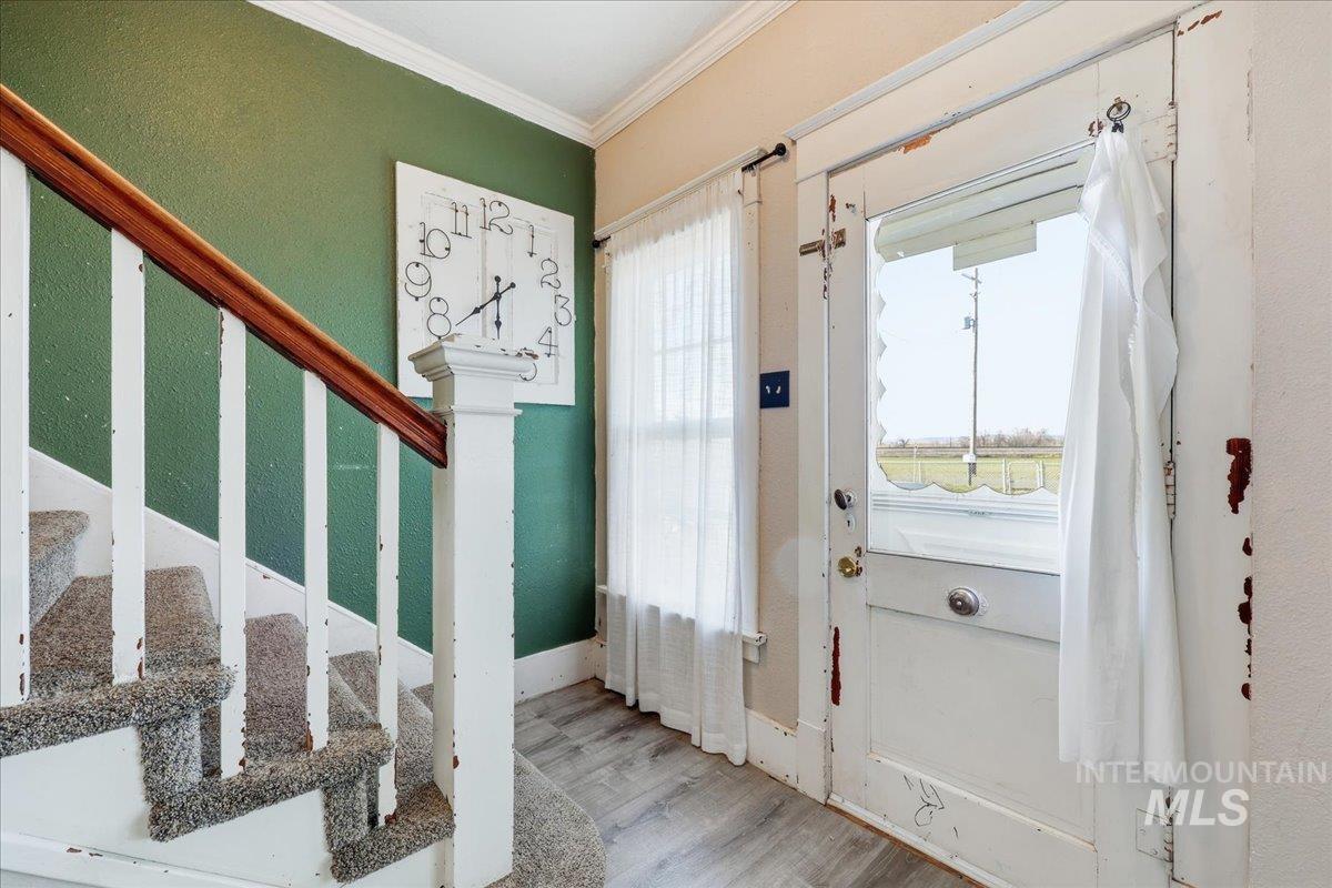 148 Glascock Road Weiser, ID 83672 - Photo 13 of 32 Entryway with ornamental molding and wood finished floors