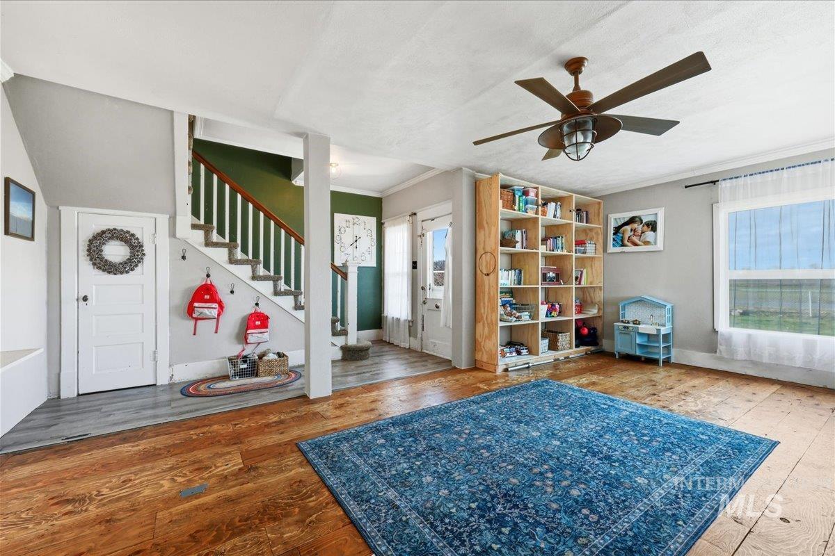 148 Glascock Road Weiser, ID 83672 - Photo 15 of 32 Foyer entrance featuring hardwood / wood-style flooring, crown molding, and ceiling fan
