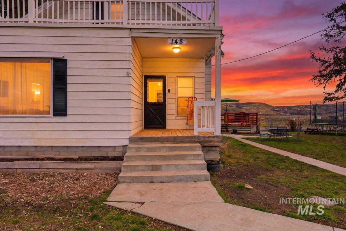 148 Glascock Road Weiser, ID 83672 - Photo 2 of 32 Doorway to property with covered porch and a mountain view