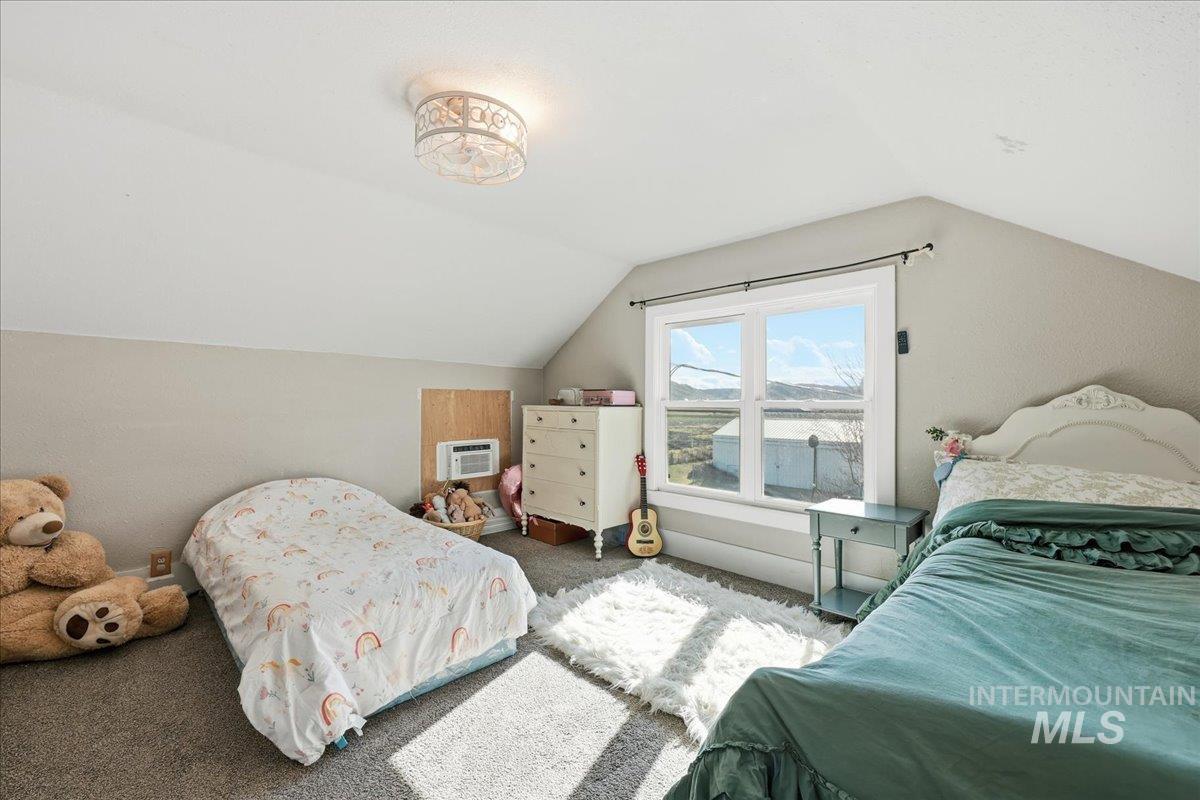 148 Glascock Road Weiser, ID 83672 - Photo 22 of 32 Carpeted bedroom featuring a wall unit AC