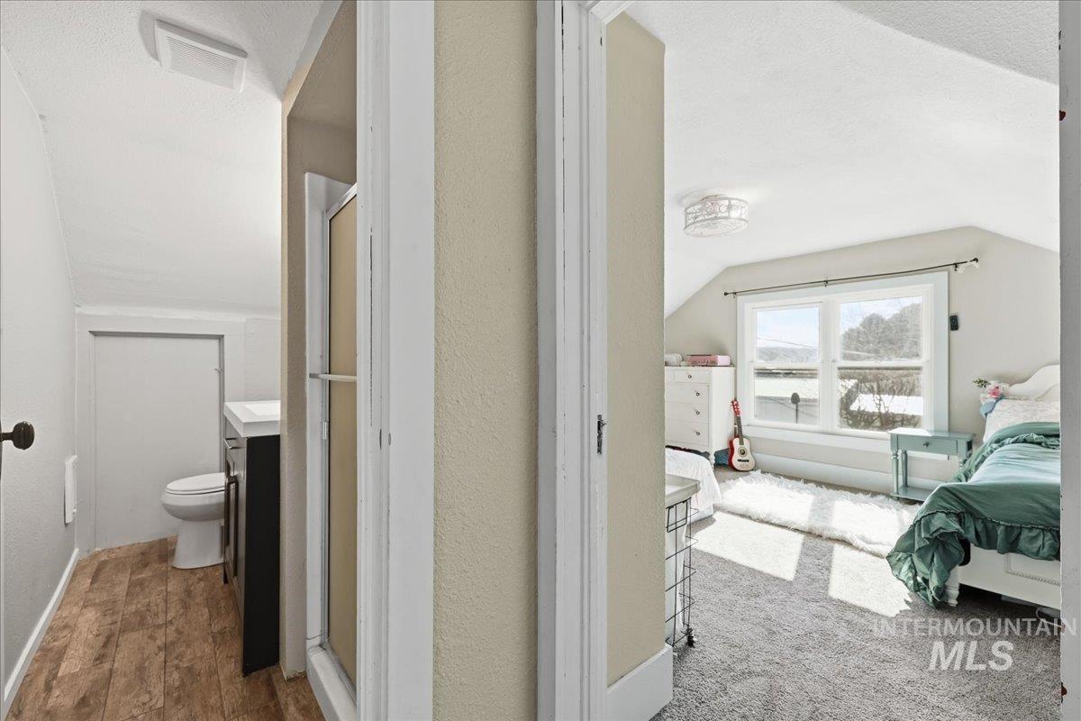 148 Glascock Road Weiser, ID 83672 - Photo 24 of 32 Bathroom featuring ensuite bath, a stall shower, and vanity