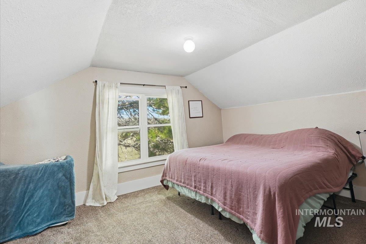 148 Glascock Road Weiser, ID 83672 - Photo 27 of 32 Bedroom with carpet floors and a textured ceiling