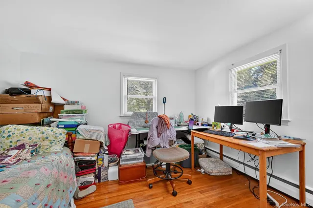 a workspace with furniture and a window