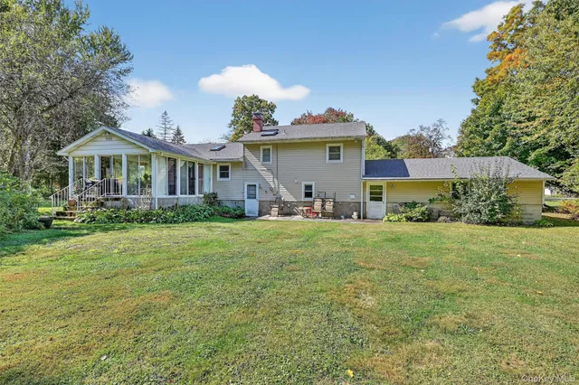 a view of a house with a big yard