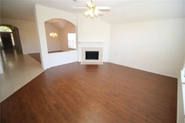 a view of empty room with fireplace