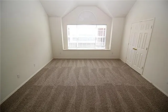 a bathroom with a granite countertop sink and a bathtub