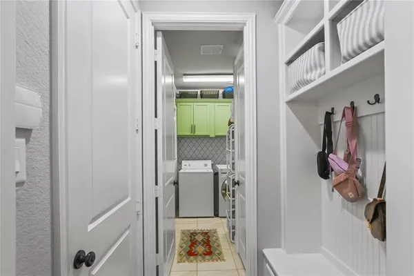 a bathroom with a glass door shower and a sink