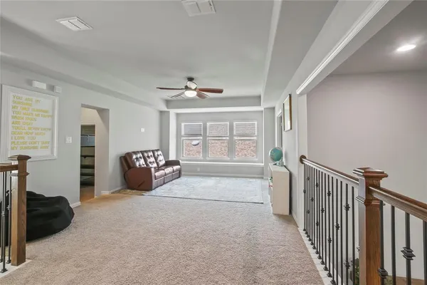 a view of an empty room and a window