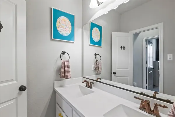 a bathroom with a sink a toilet and shower curtain