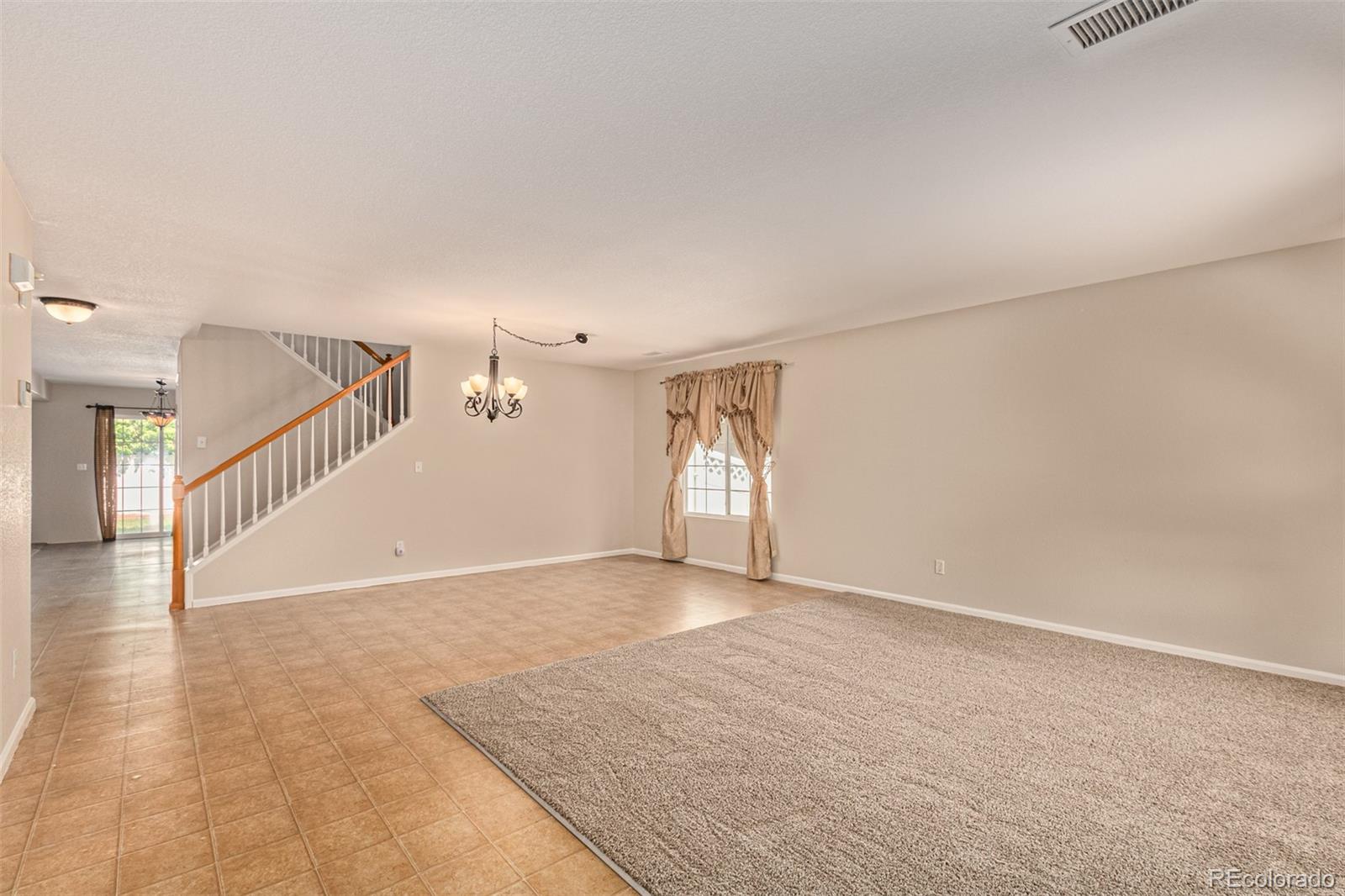 5344 North Perth Street Denver, CO 80249 - Photo 15 of 39 a view of empty room with wooden floor