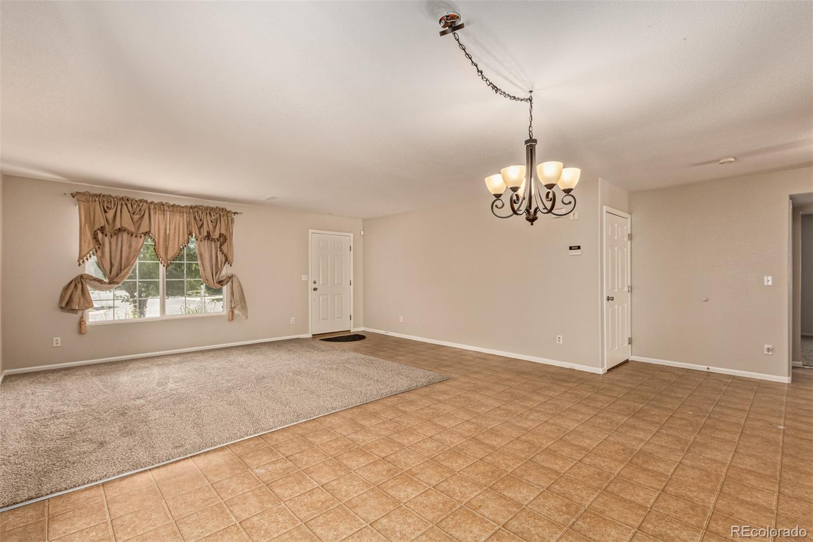 5344 North Perth Street Denver, CO 80249 - Photo 16 of 39 a view of an empty room with a window