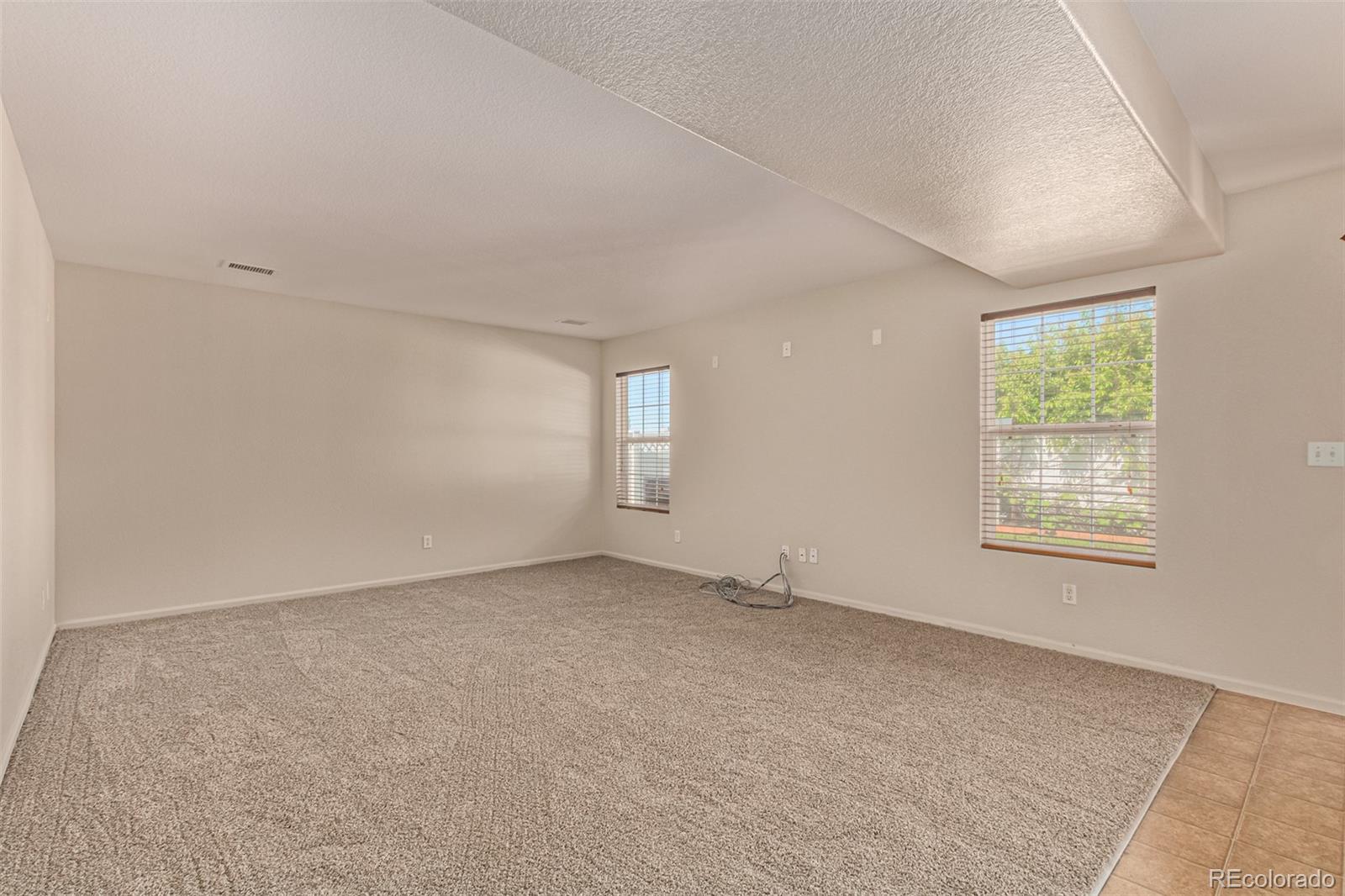 5344 North Perth Street Denver, CO 80249 - Photo 19 of 39 an empty room with windows