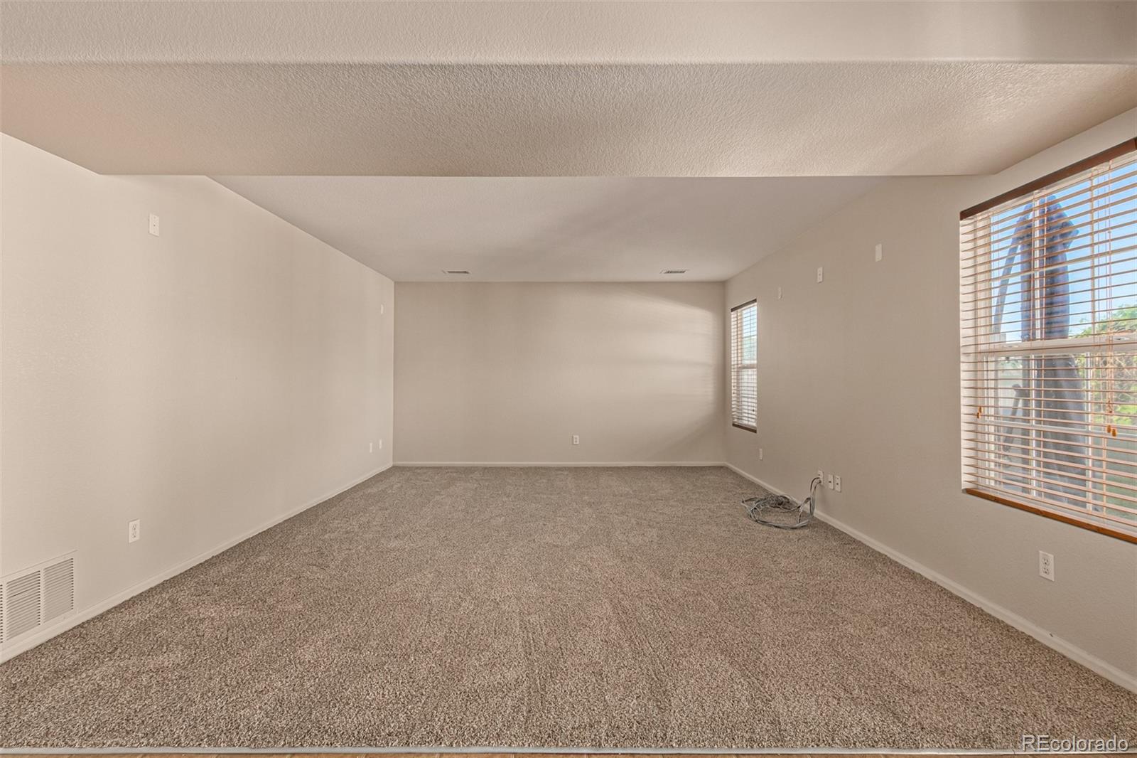 5344 North Perth Street Denver, CO 80249 - Photo 20 of 39 a view of an empty room with a window