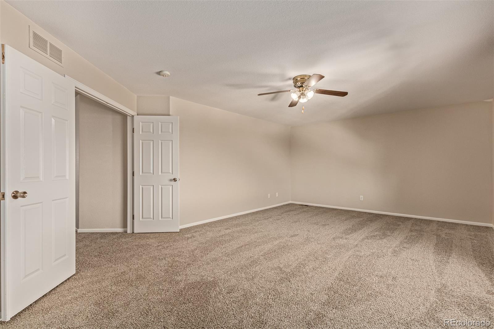 5344 North Perth Street Denver, CO 80249 - Photo 25 of 39 a view of a chandelier fan in big room