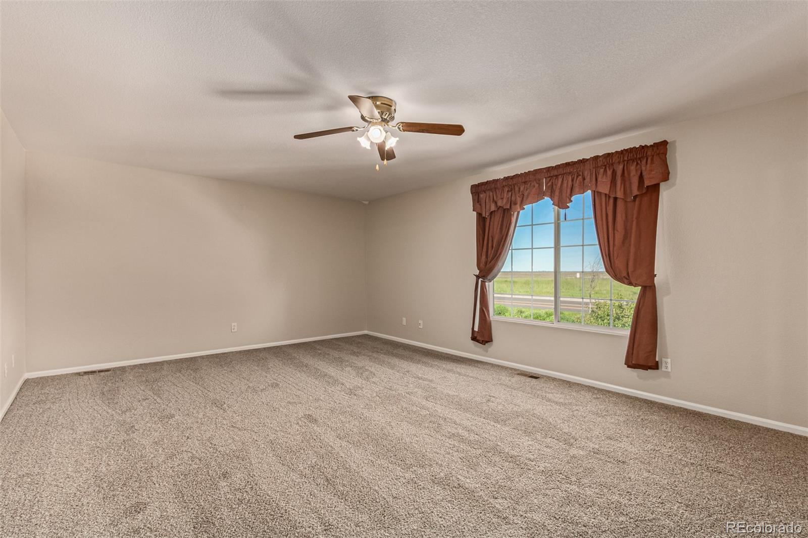 5344 North Perth Street Denver, CO 80249 - Photo 27 of 39 a view of an empty room with a window