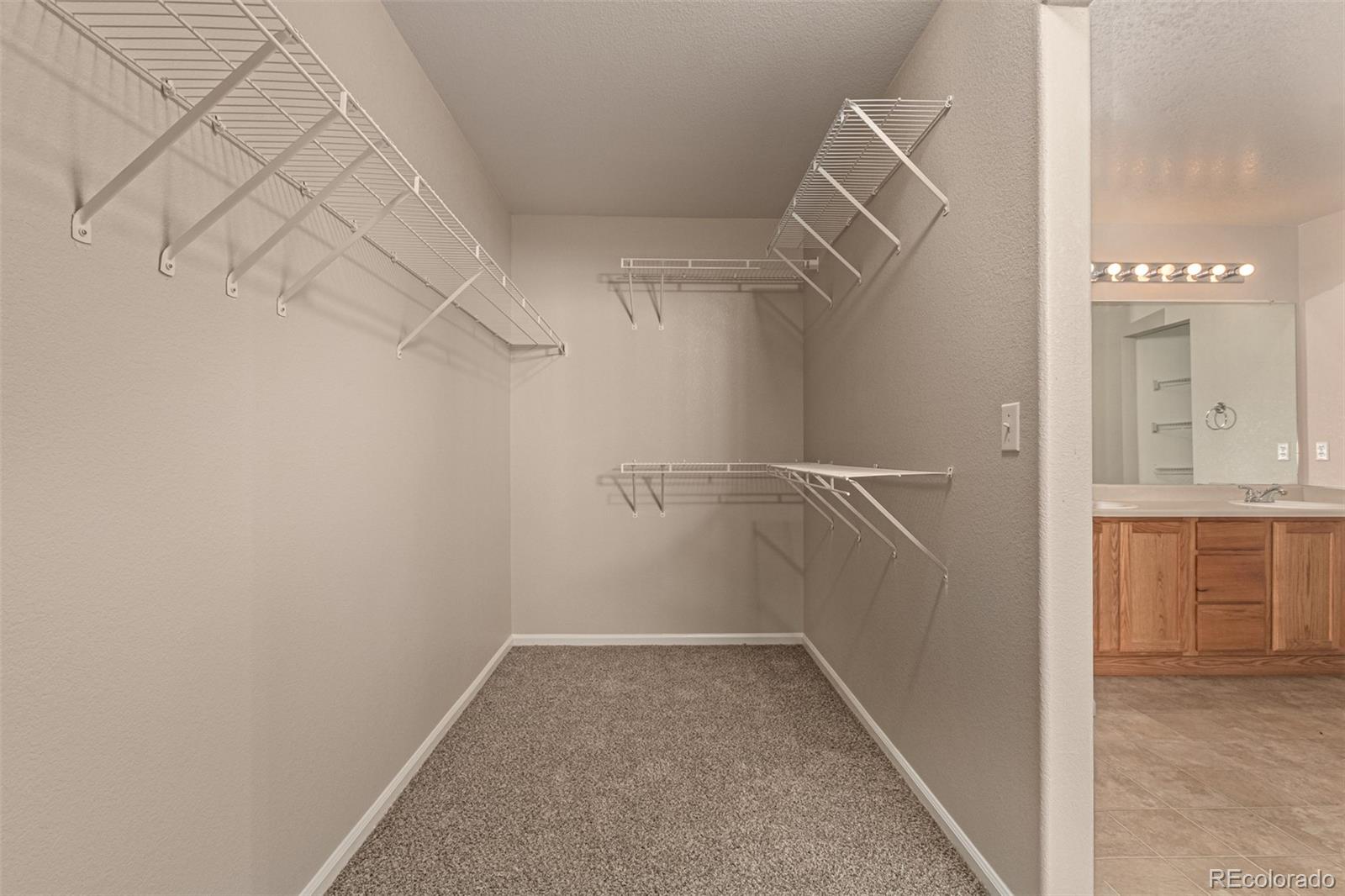 5344 North Perth Street Denver, CO 80249 - Photo 30 of 39 a view of walk in closet