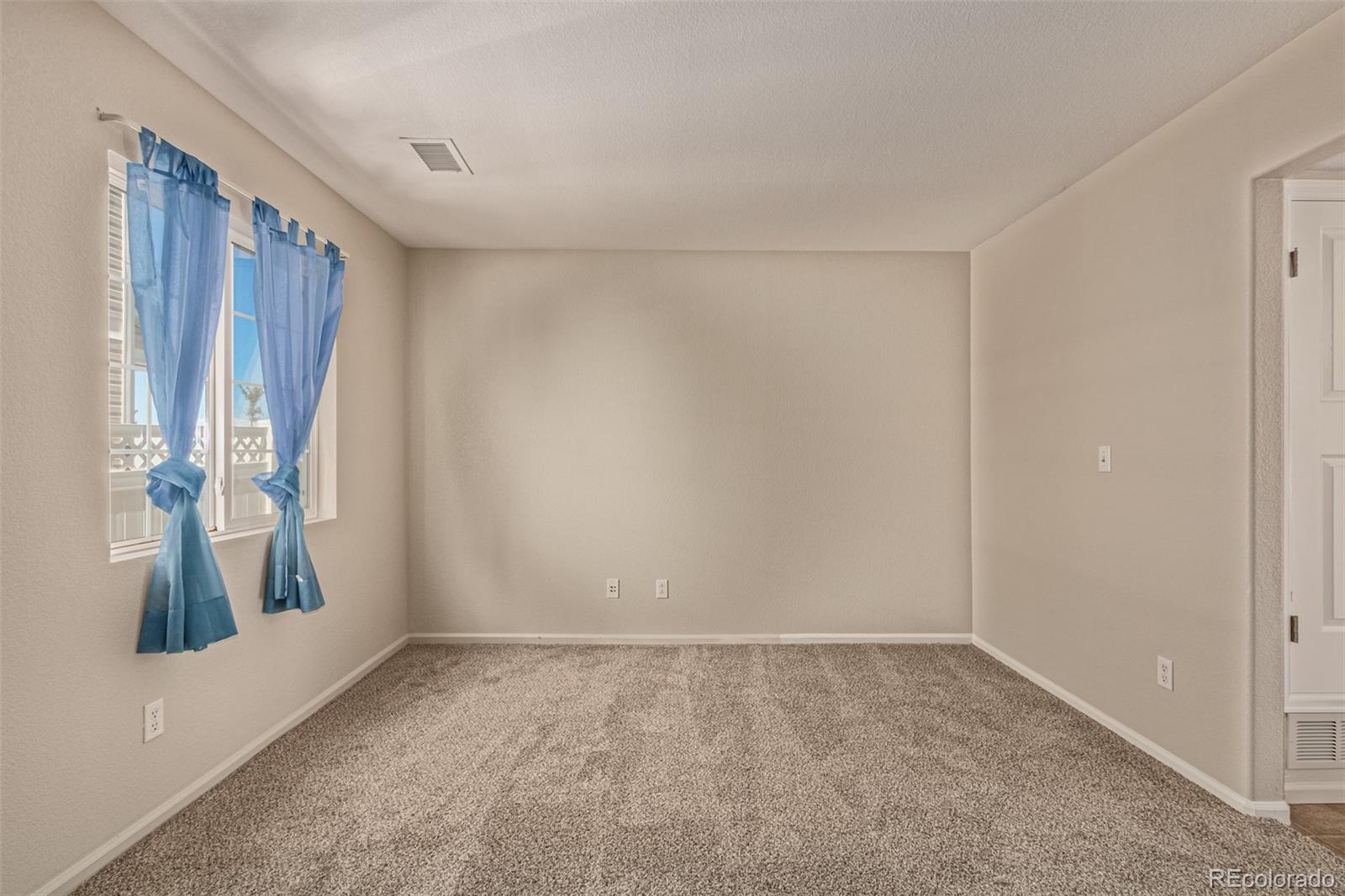 5344 North Perth Street Denver, CO 80249 - Photo 32 of 39 a view of an empty room with a window