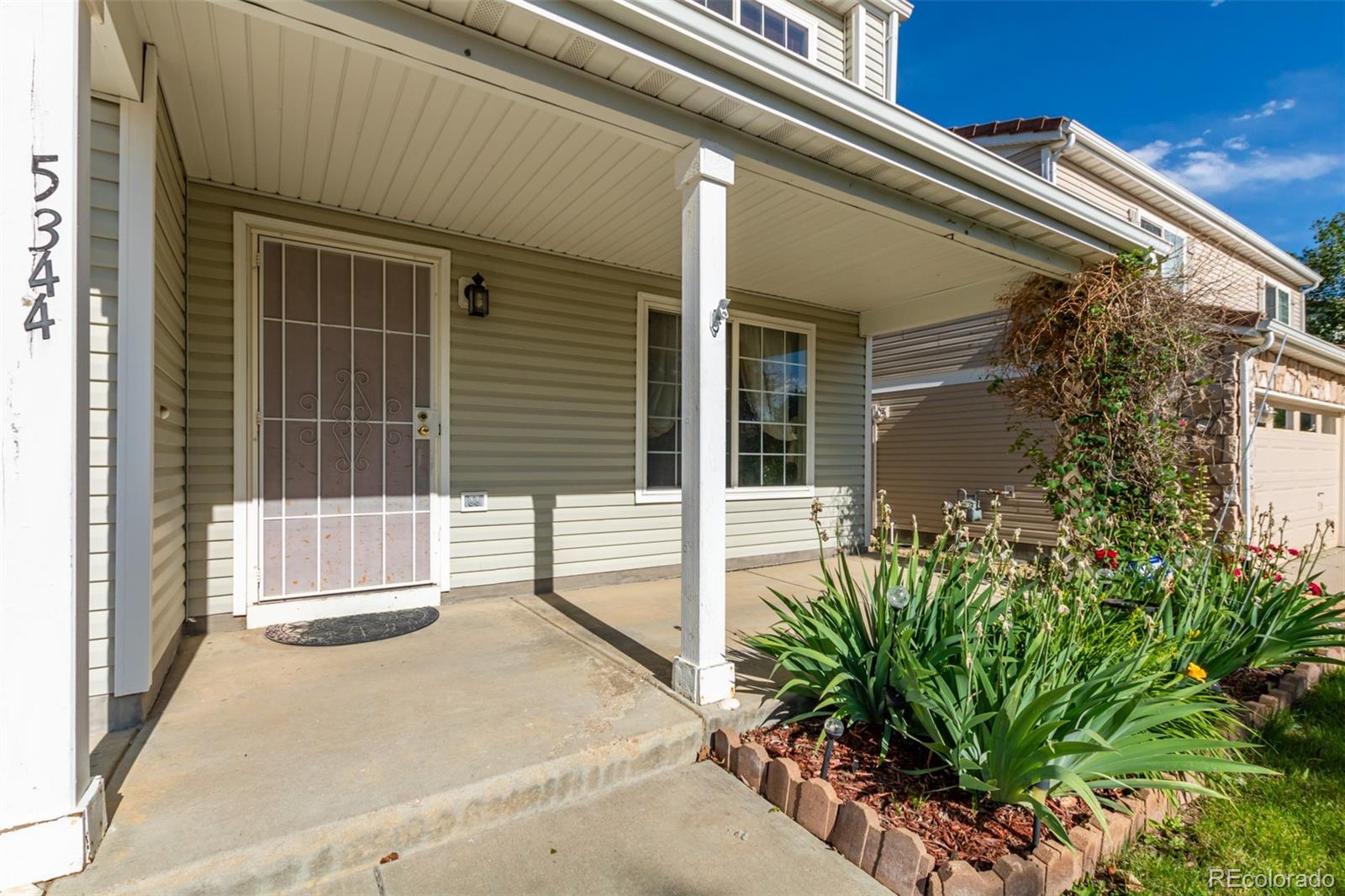 5344 North Perth Street Denver, CO 80249 - Photo 4 of 39 a house view with a outdoor space