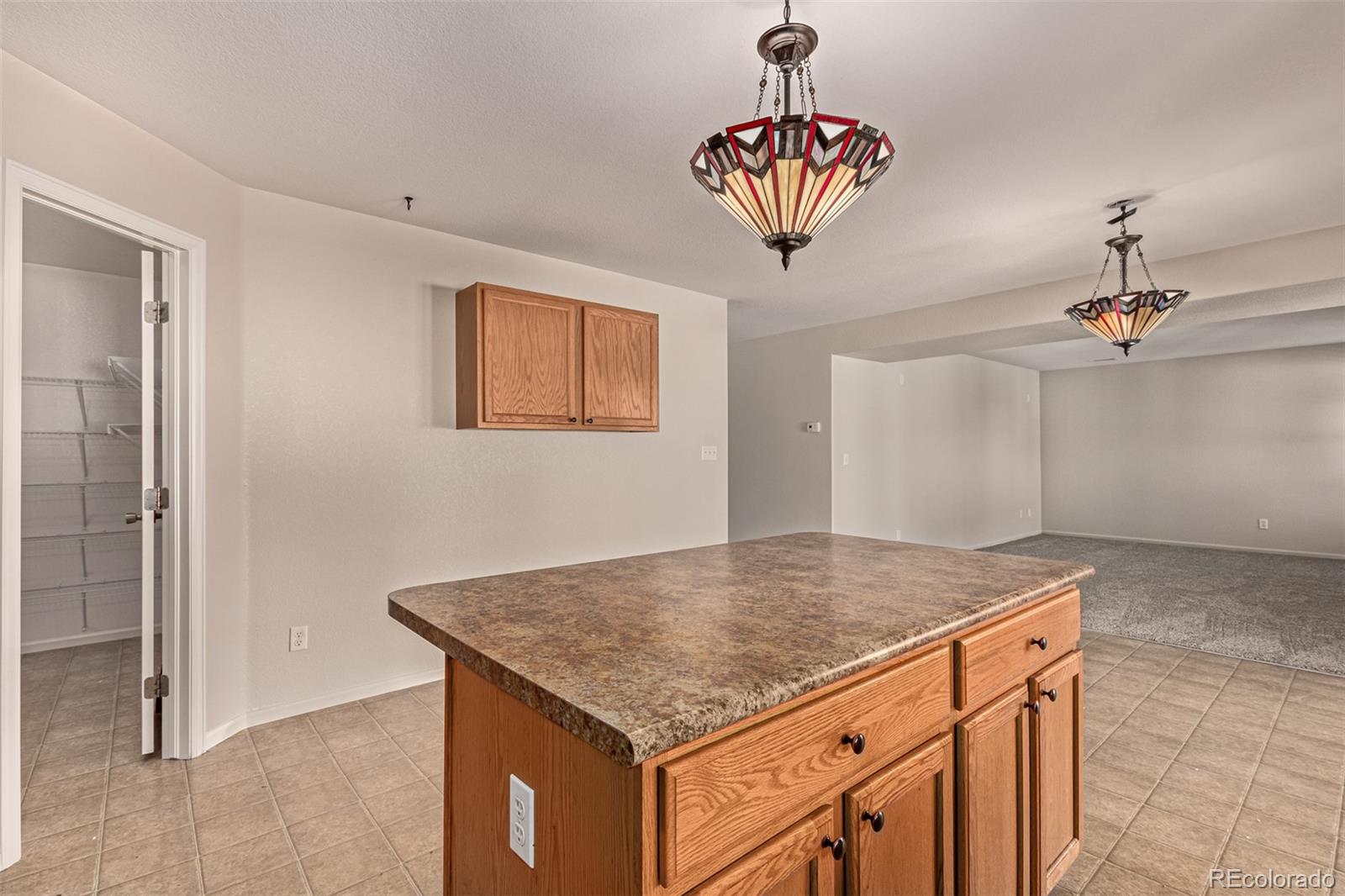 5344 North Perth Street Denver, CO 80249 - Photo 9 of 39 a view of kitchen island
