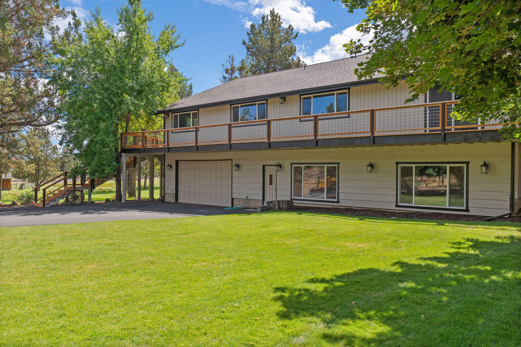 62155 Cody Road Bend, OR 97701 - Photo 1 of 61 a view of a house with a swimming pool