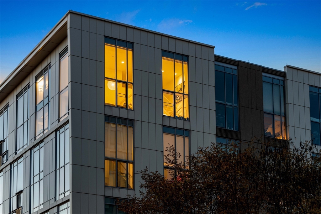 a view of a brick house with a large window