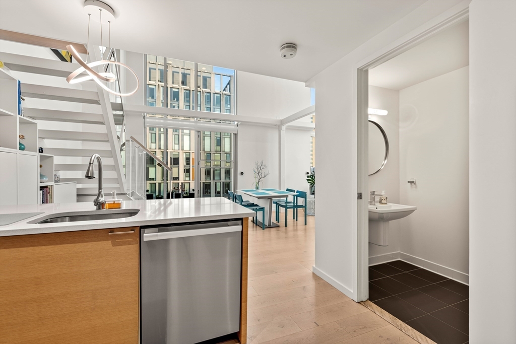 1 Earhart Street, Unit 705 Cambridge, MA 02141 - Photo 14 of 38 a room with a table and chairs